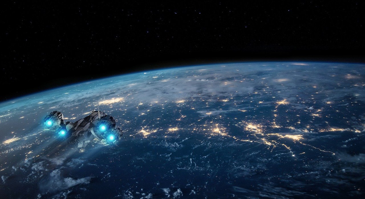Foto: Planet Erde mit einem Raumschiff in der Erdumlaufbahn